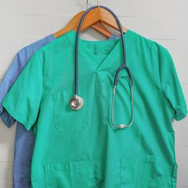 Poor pay and lack of clarity rife in role of healthcare assistant, report finds